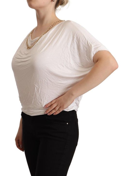 Woman wearing white blouse and black pants