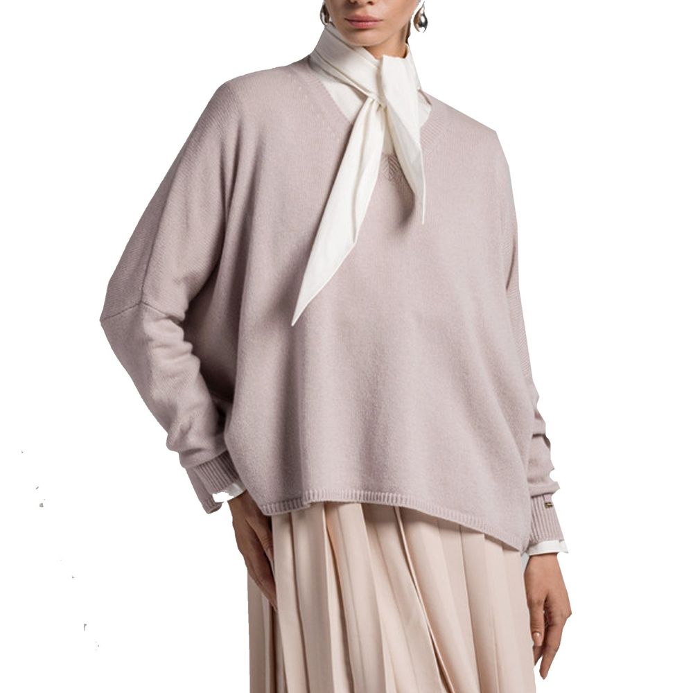 Woman wearing a pink sweater and skirt