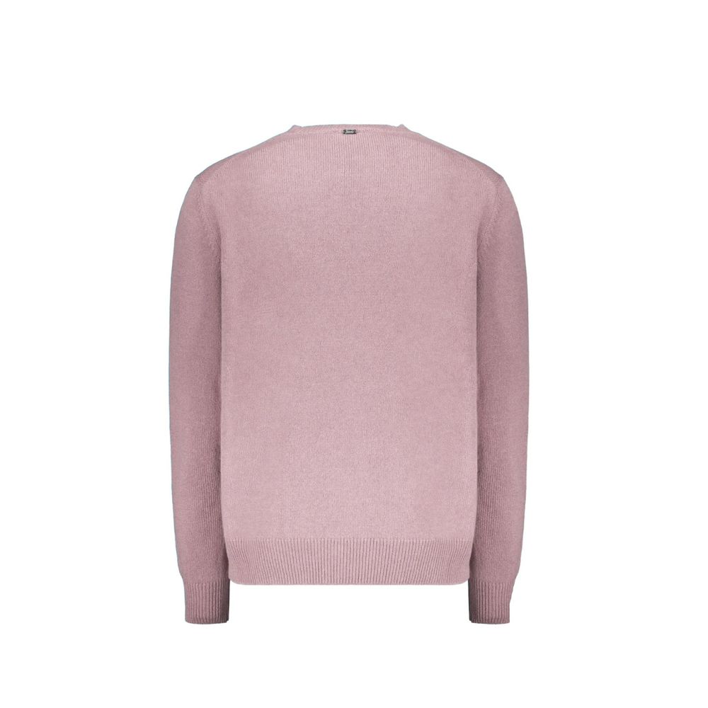 Pink sweater on hanger