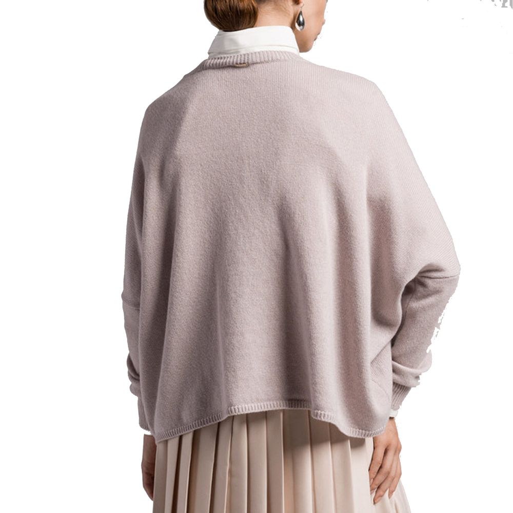 Woman wearing a pink sweater and skirt