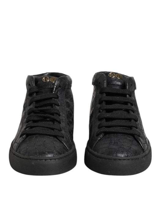 Pair of black sneakers with white laces