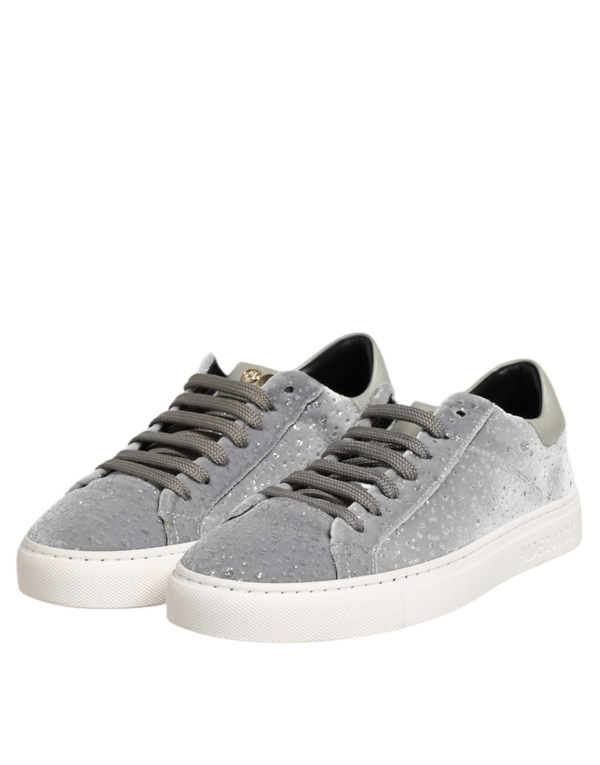 Pair of grey sneakers with white soles