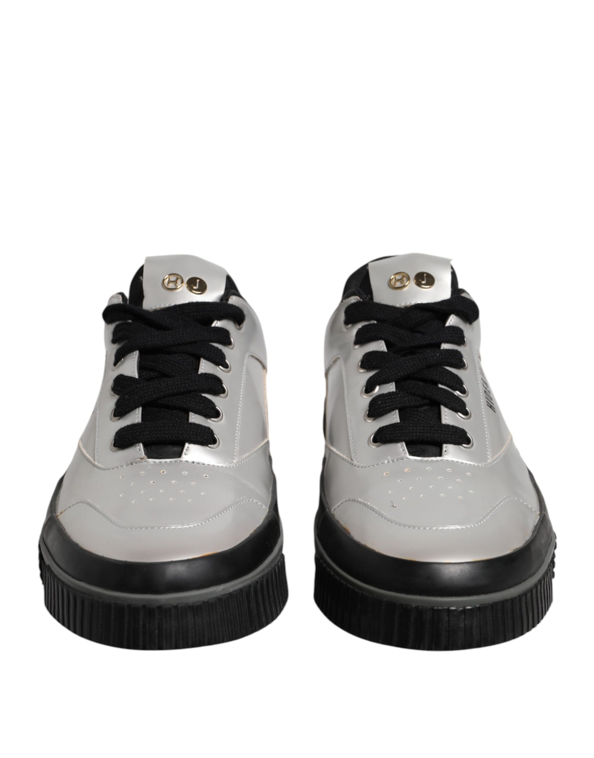Pair of silver sneakers with black laces