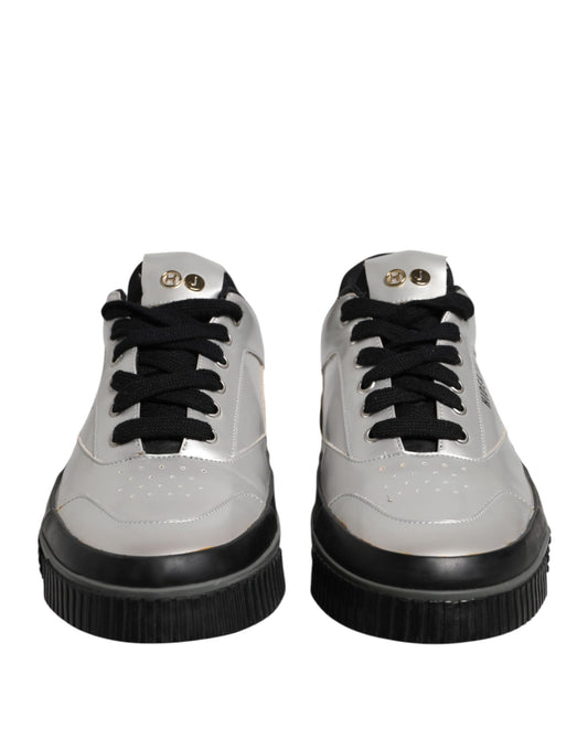 Pair of silver sneakers with black laces