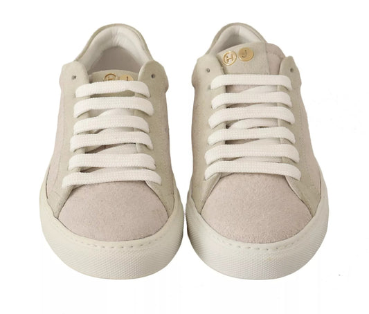 Pair of light beige sneakers with white laces