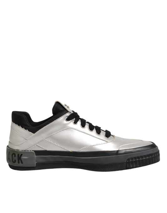 White sneaker with black laces and a black logo on the side