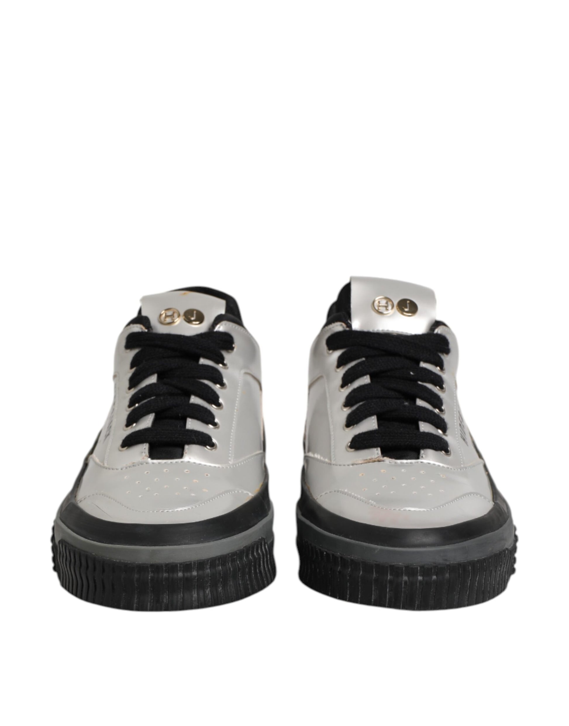 Pair of silver sneakers with black laces