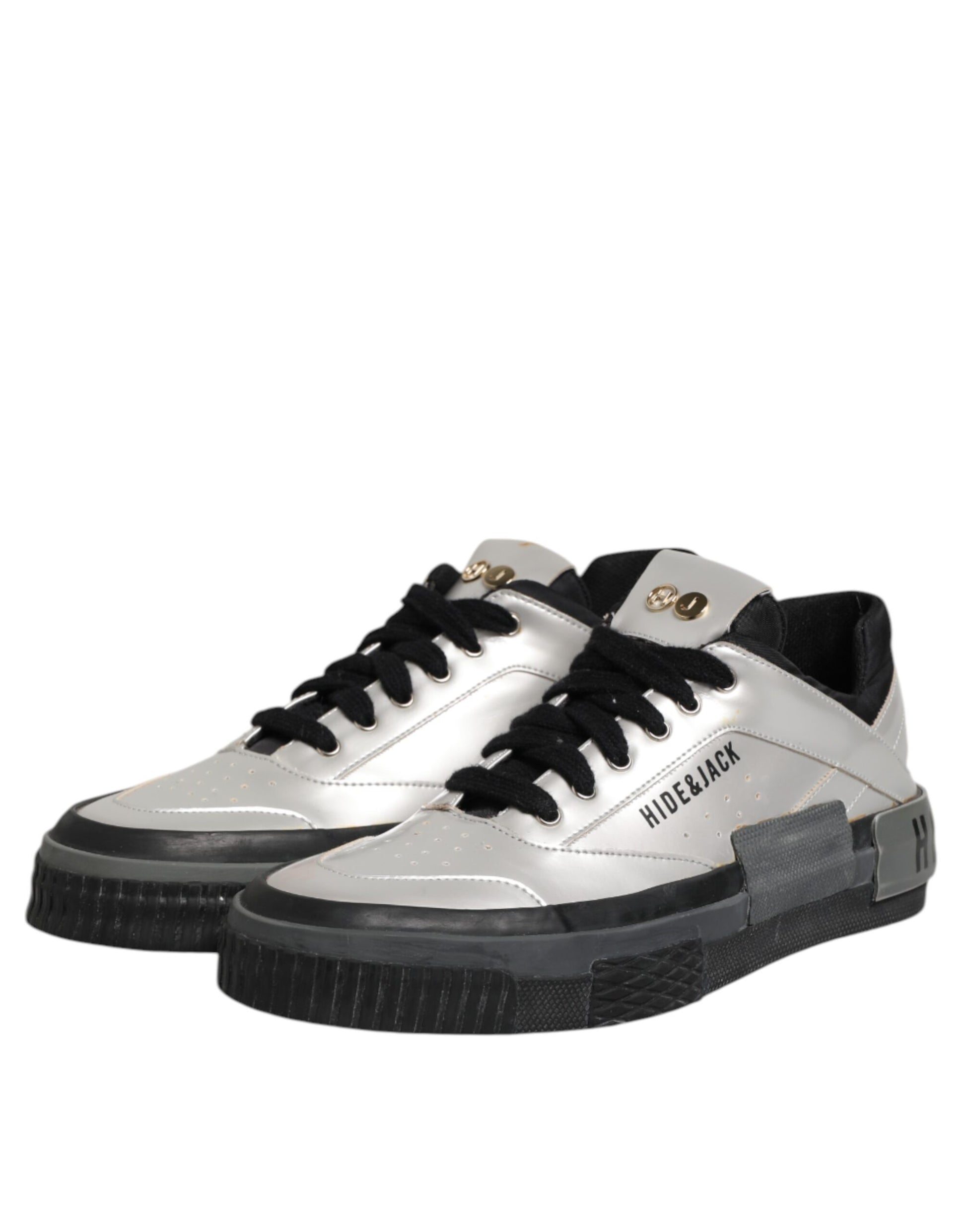 Silver sneakers with black laces and gold accents