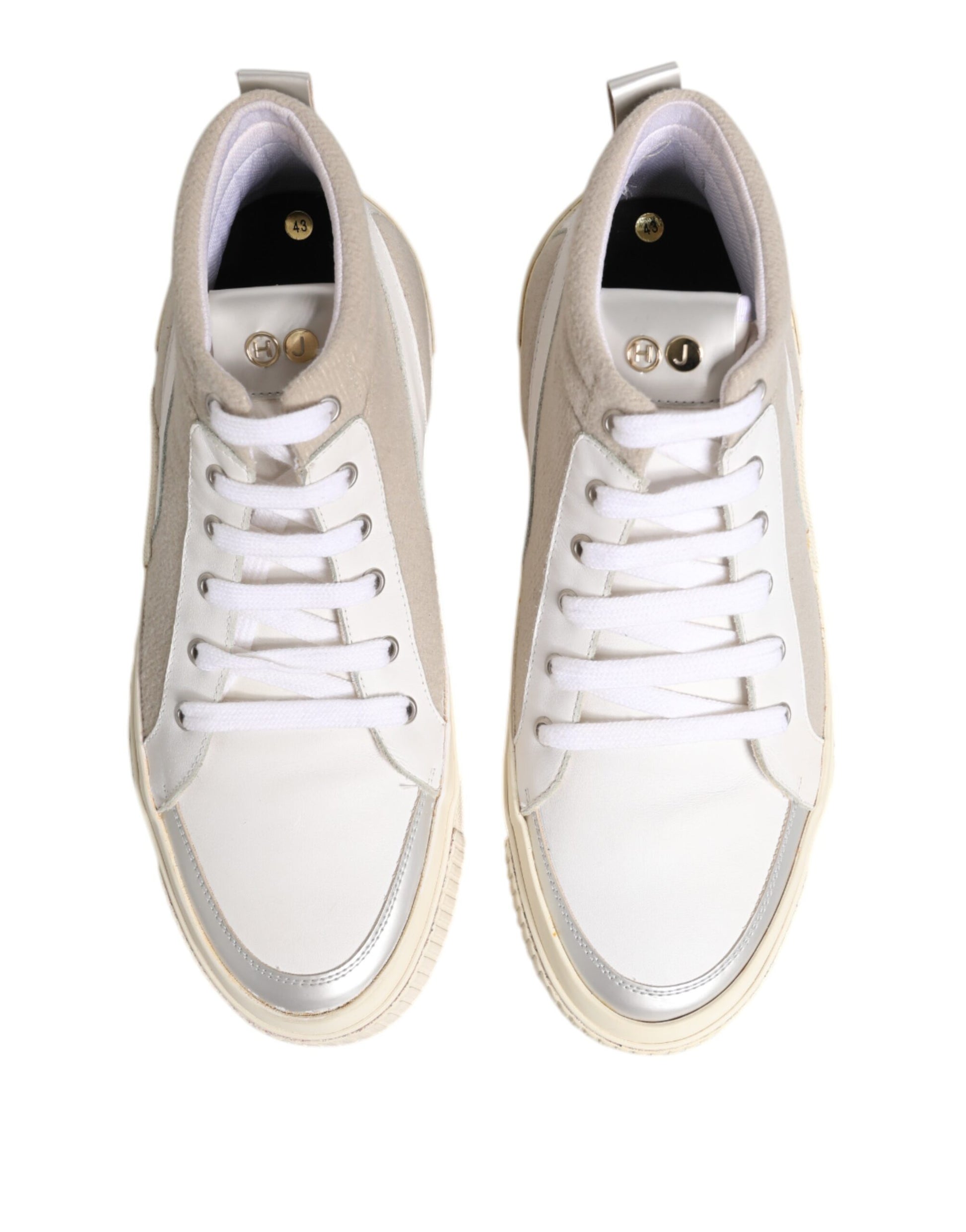 Pair of white sneakers with black laces