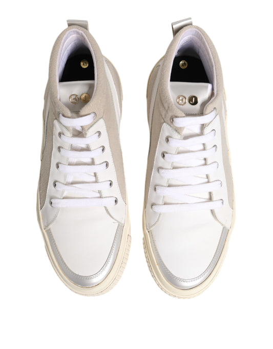 Pair of white sneakers with black laces