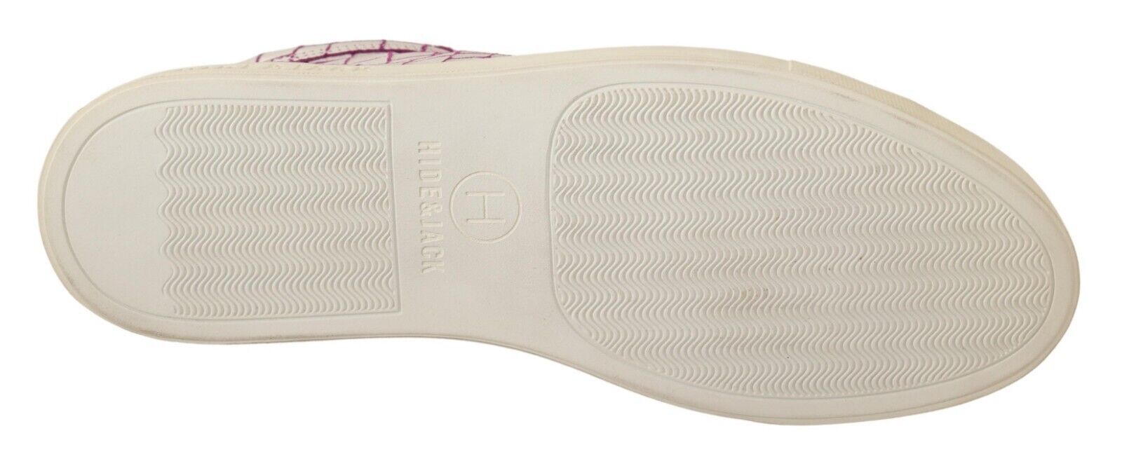 Pair of white sneakers with black soles and laces