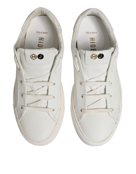 Pair of white sneakers with gold accents