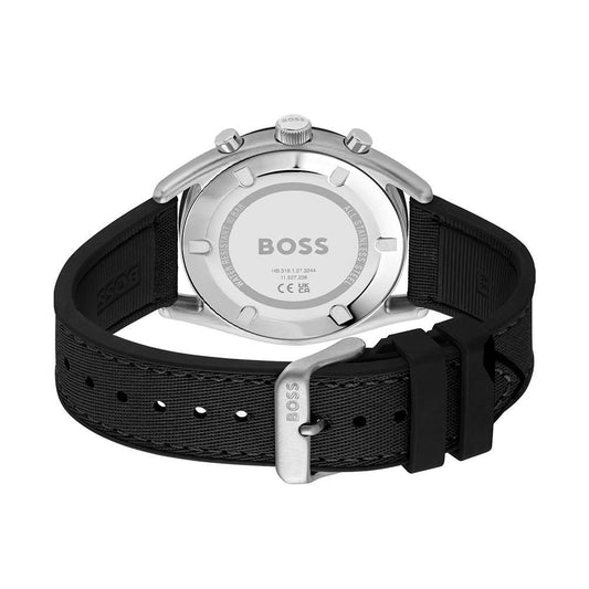 A black watch with a silver face and white hands from Hugo Boss, featuring a black strap and the brand name on the dial