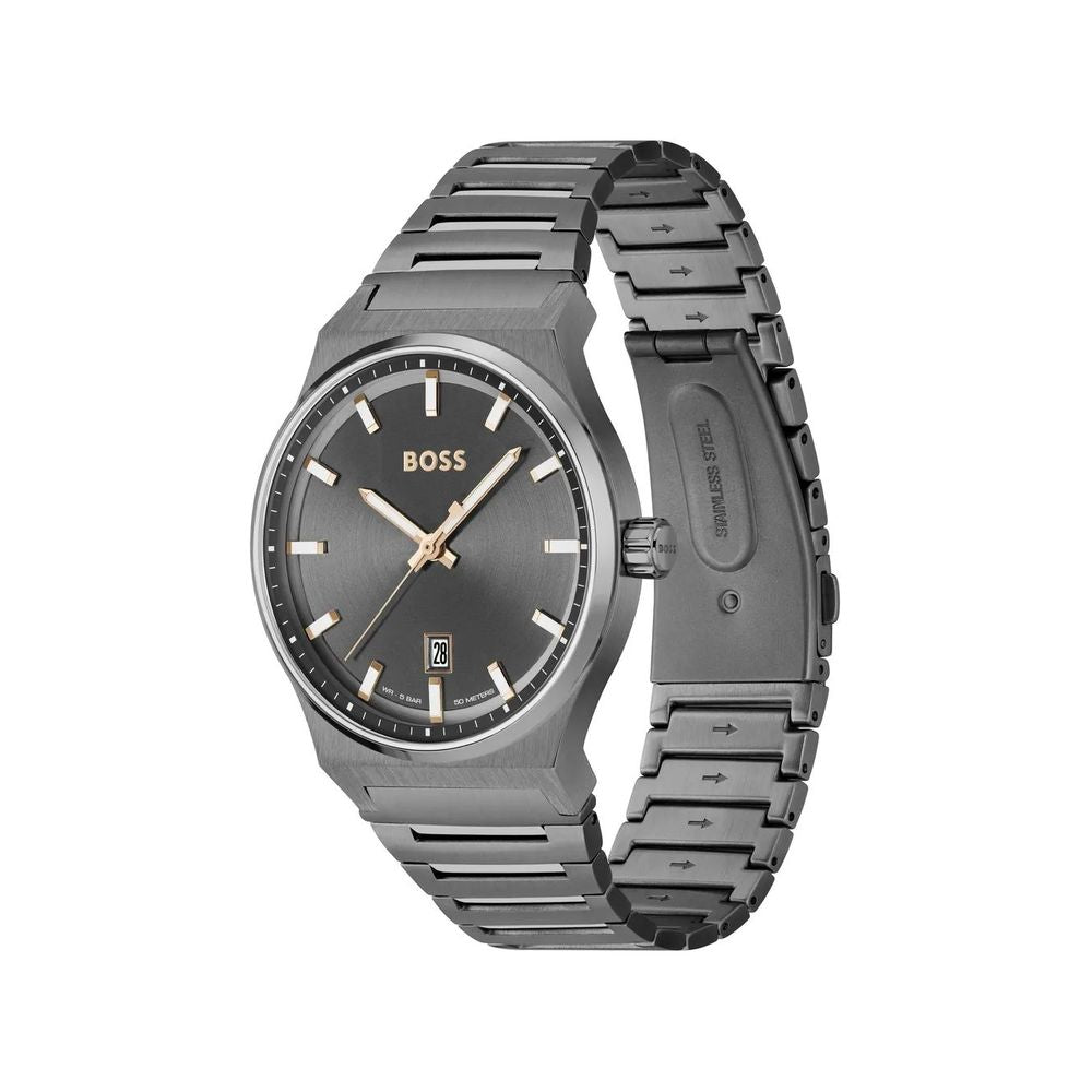 A gray stainless steel watch with a black face, gold hands, and logo on the dial