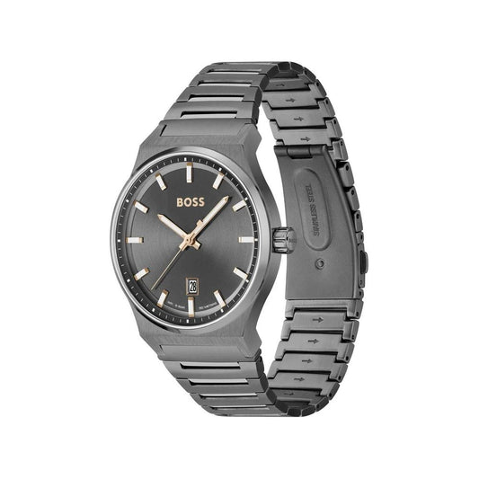 A gray stainless steel watch with a black face, gold hands, and logo on the dial