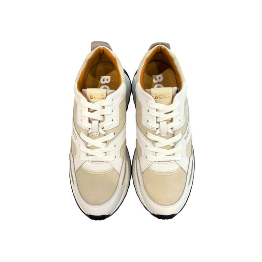 Pair of white leather men's sneakers with tan laces, branded logo on side and tongue