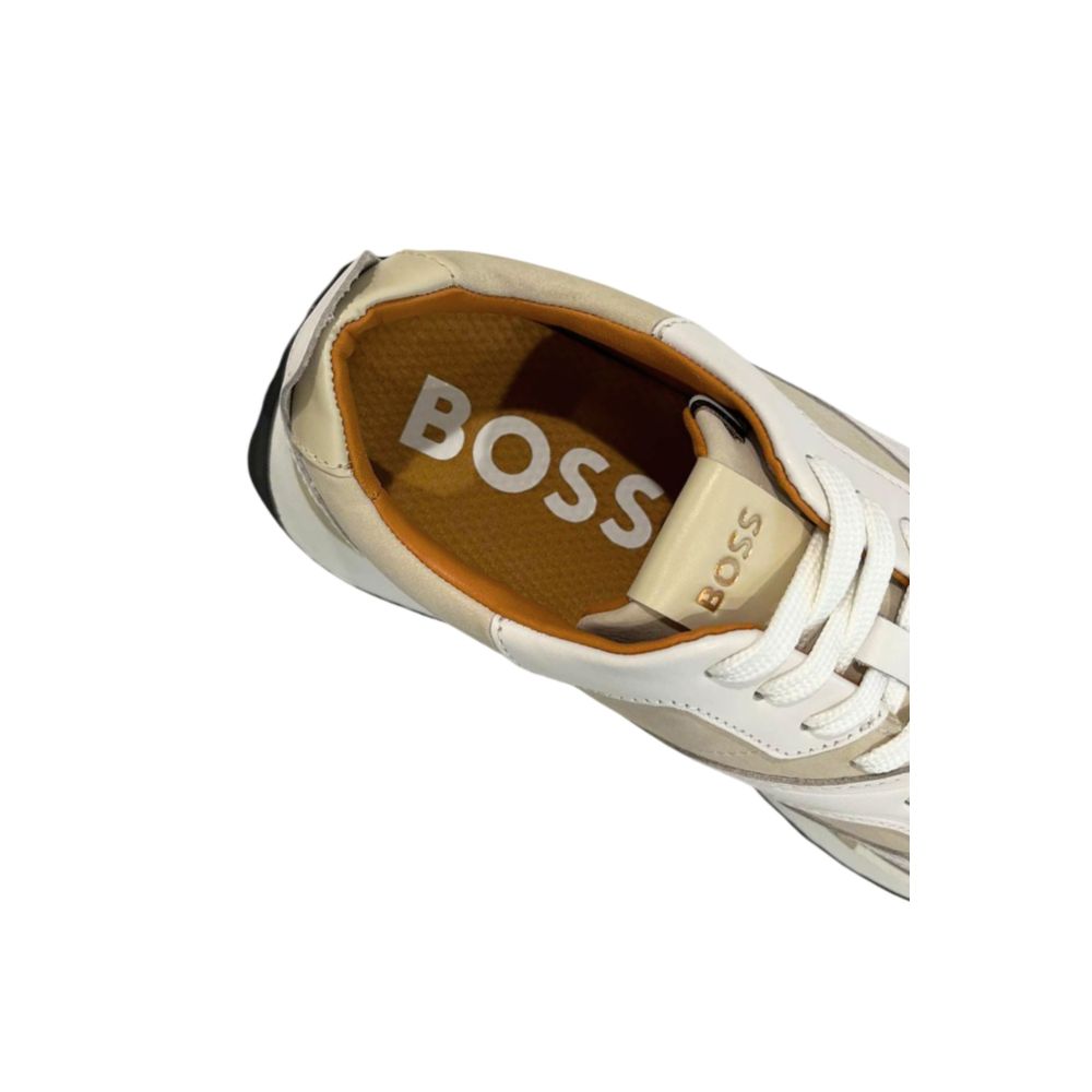 A white leather men's sneaker with a tan sole, featuring the brand name "BOSS" on the side and tongue