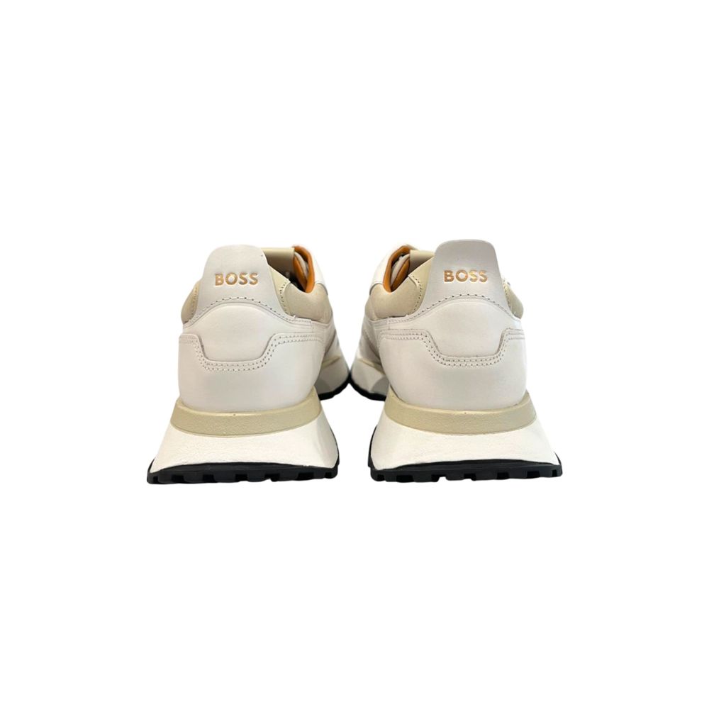 Pair of white leather men's sneakers with tan laces, branded logo on side and tongue, featuring a low-top design