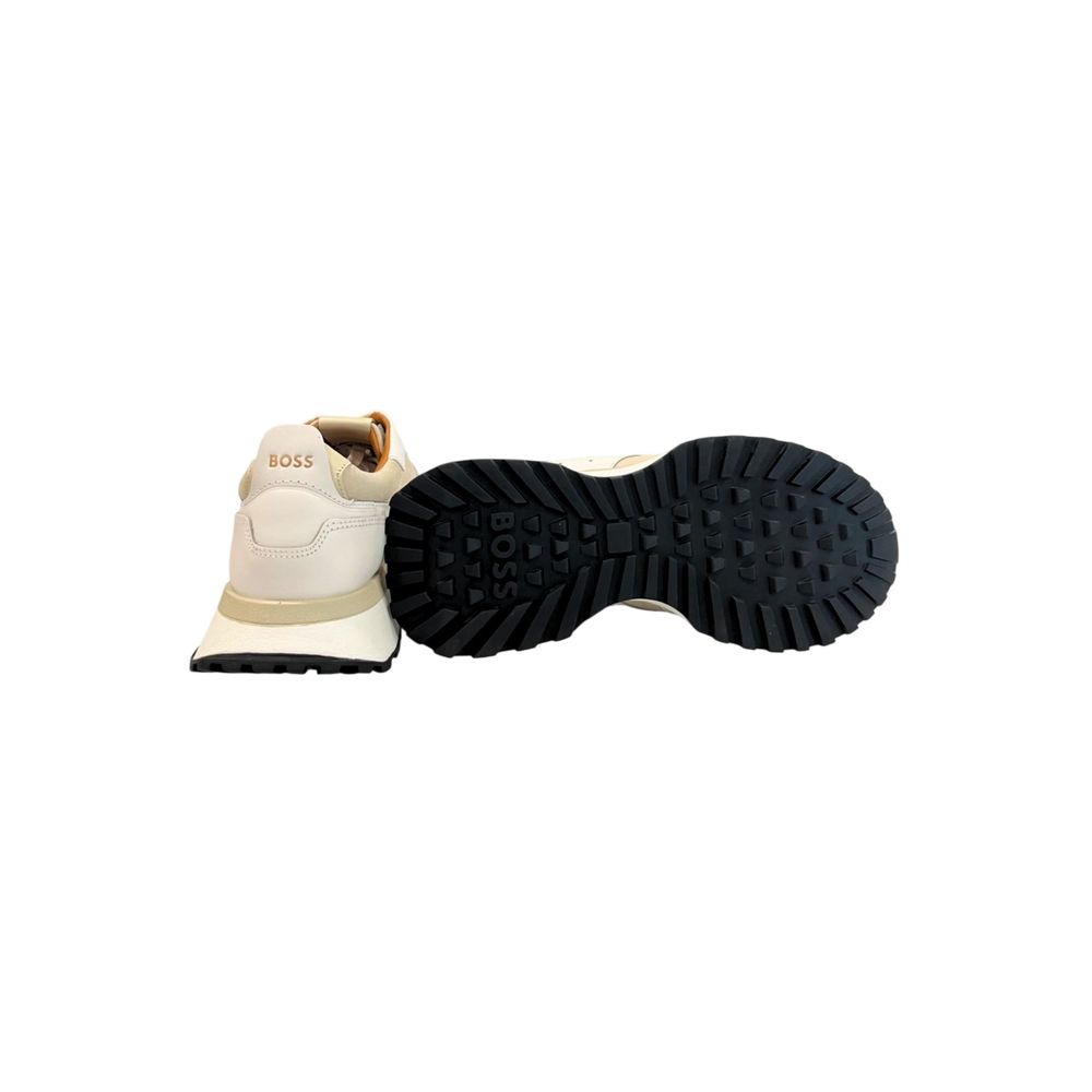 A pair of white leather men's sneakers with black soles, one shoe shown from the side and the other from the bottom