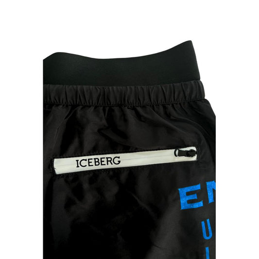 Black athletic shorts with white logo on side
