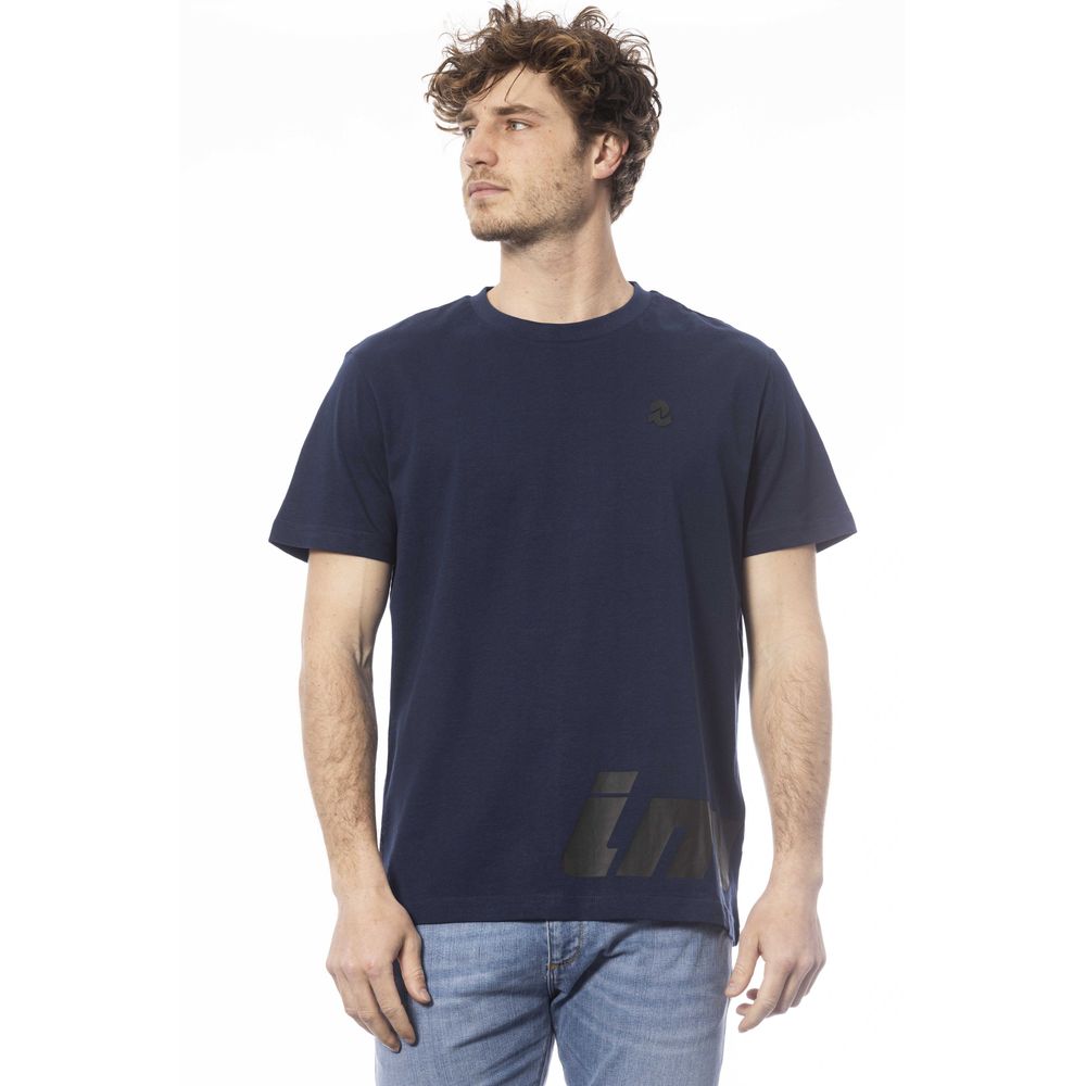Man wearing dark blue t-shirt with logo on front