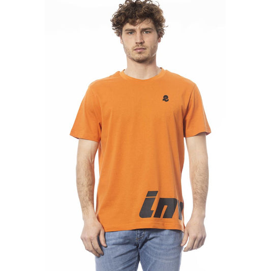 Man wearing orange t-shirt with black logo on front