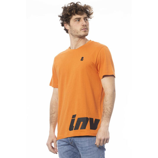 Man wearing orange t-shirt with white logo