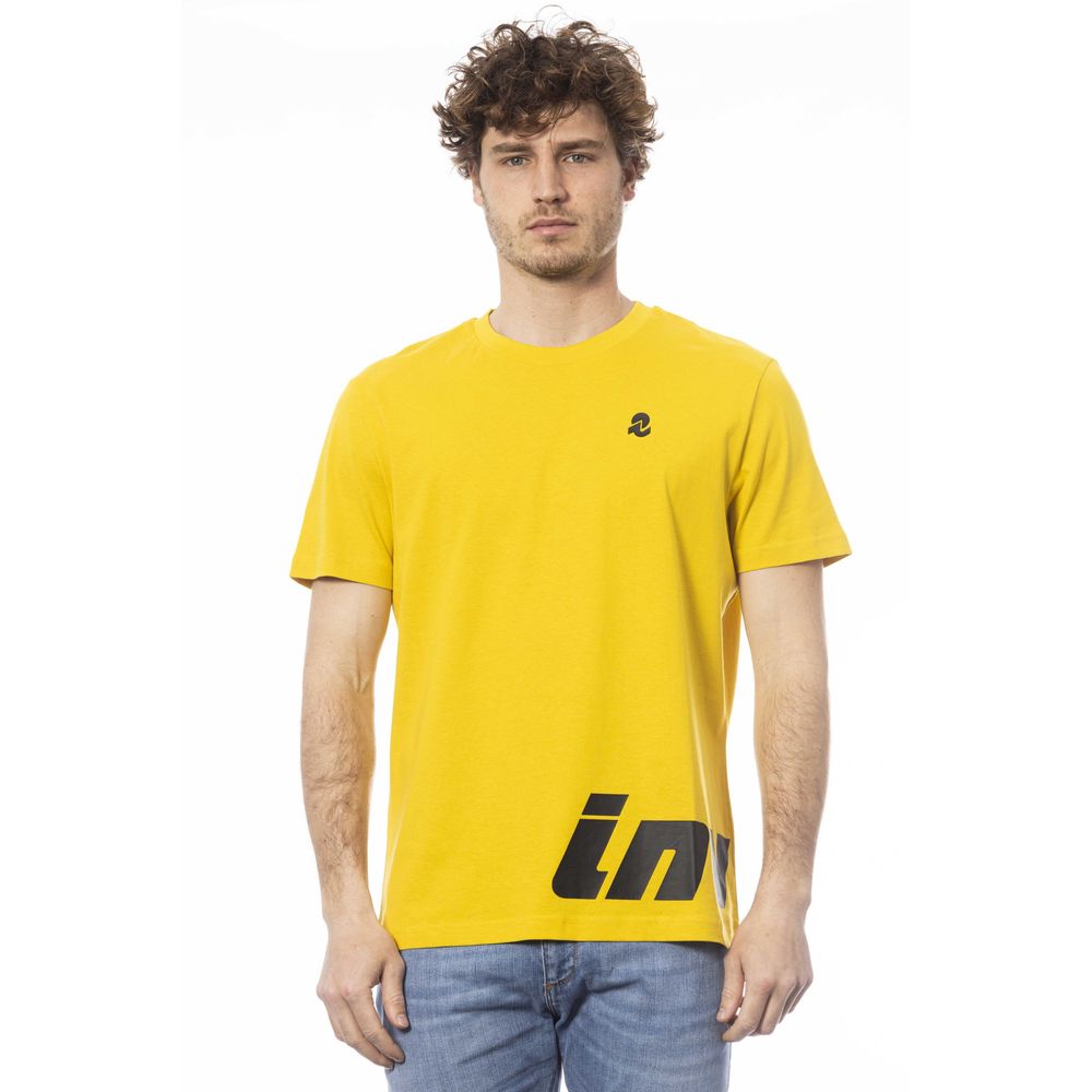 Man wearing yellow t-shirt with black logo