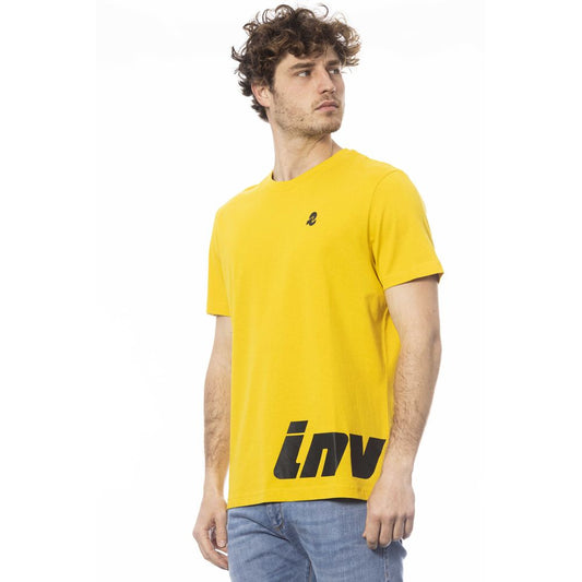 Man wearing yellow t-shirt with black logo