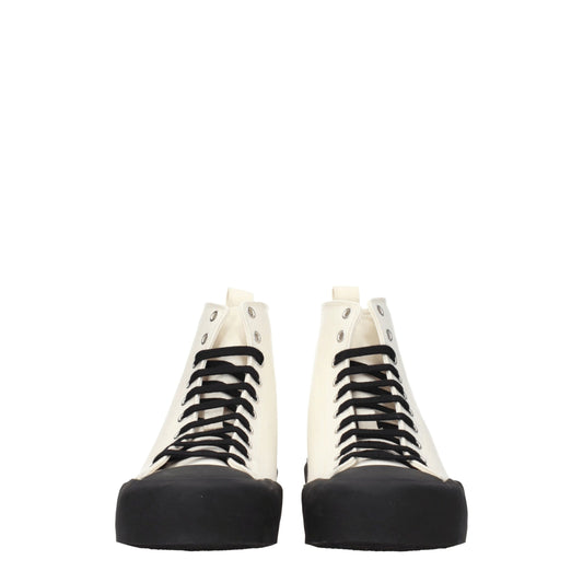 Pair of high top sneakers with beige fabric, black laces and soles