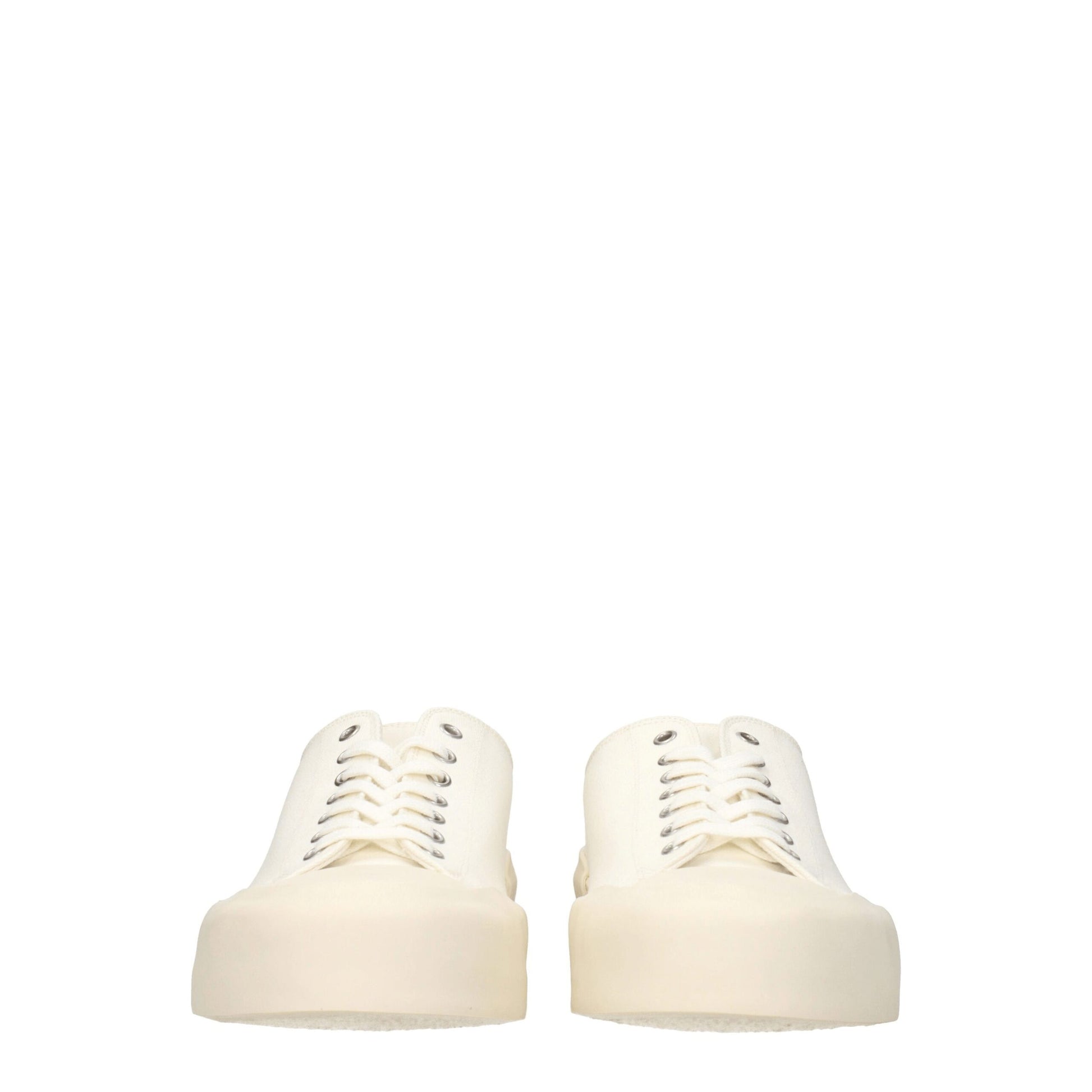 Pair of beige fabric low top sneakers with lace-up front and chunky heel