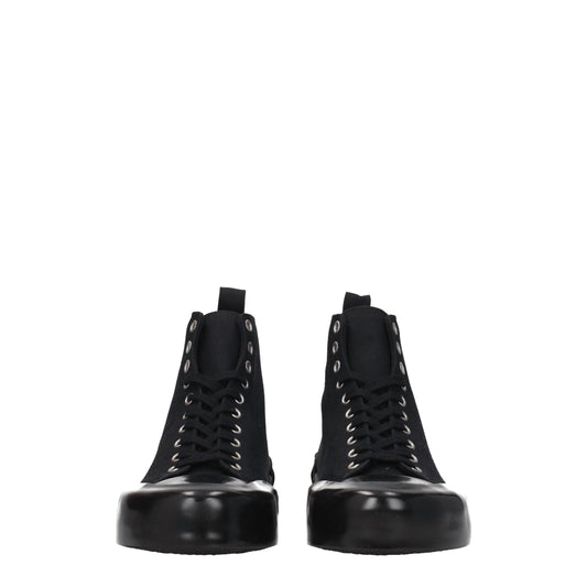 Pair of black high top sneakers with silver studs on sides