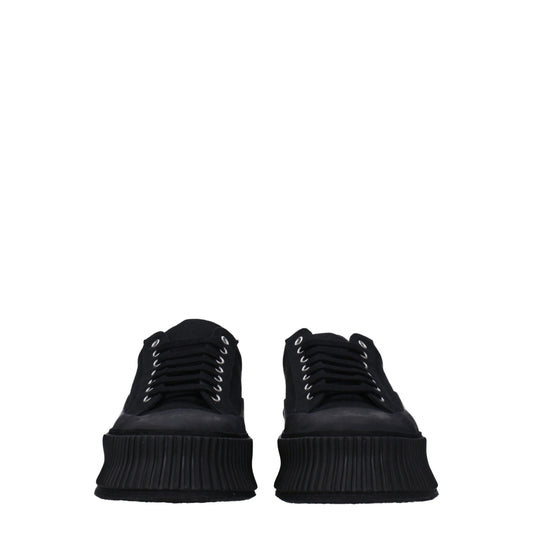 Pair of black platform sneakers with laces, featuring a chunky sole design