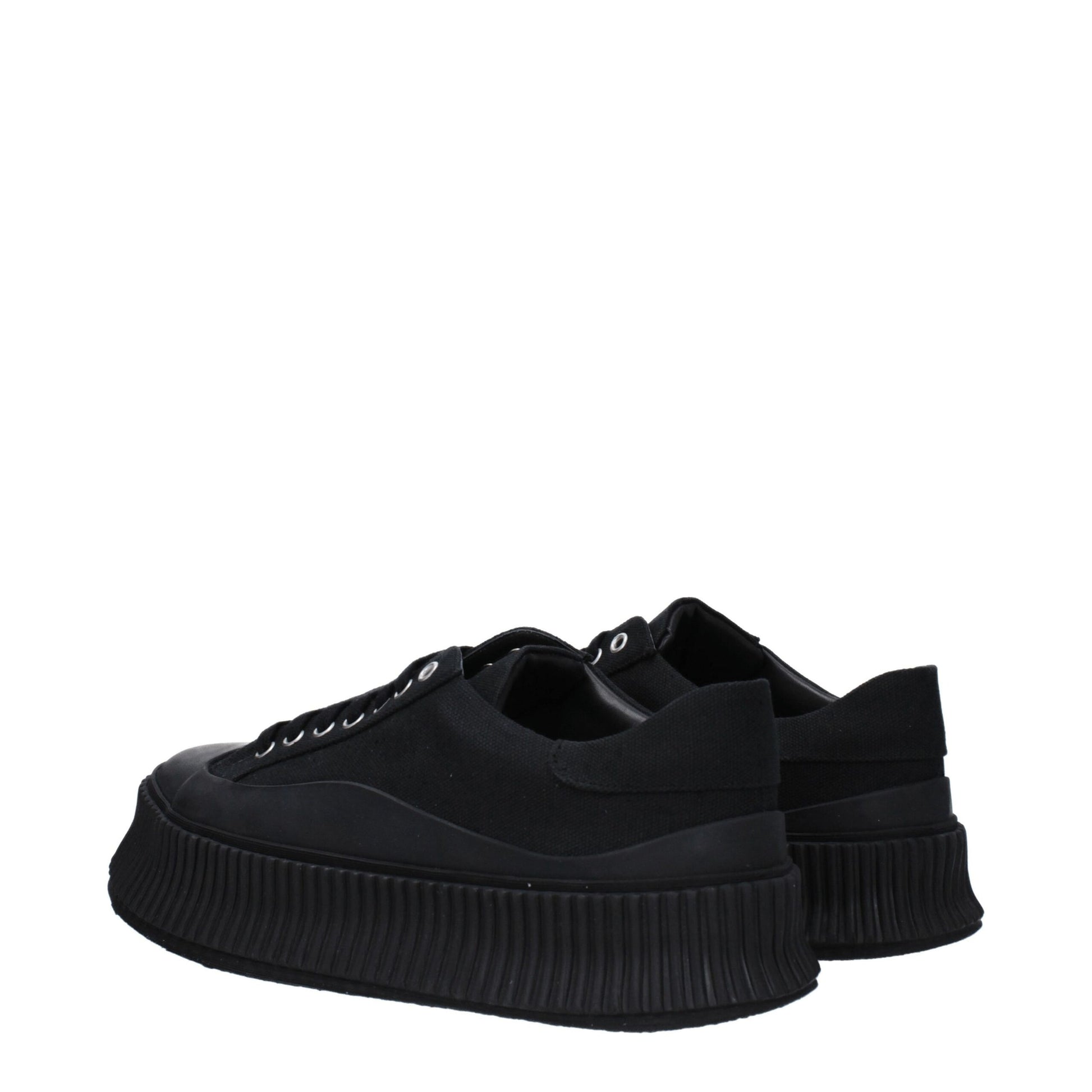 A pair of black platform sneakers with a textured sole