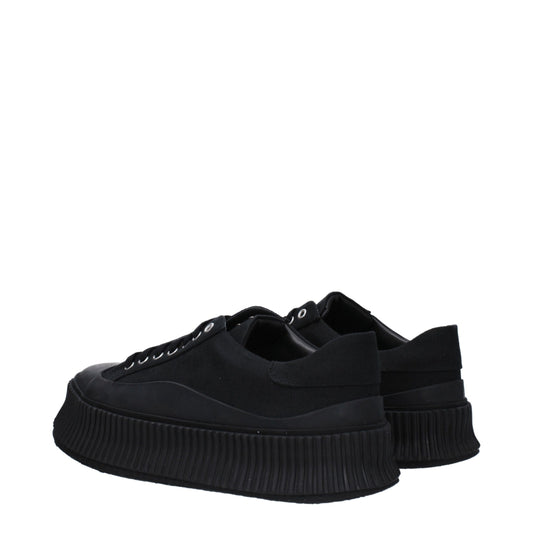 A pair of black platform sneakers with a textured sole