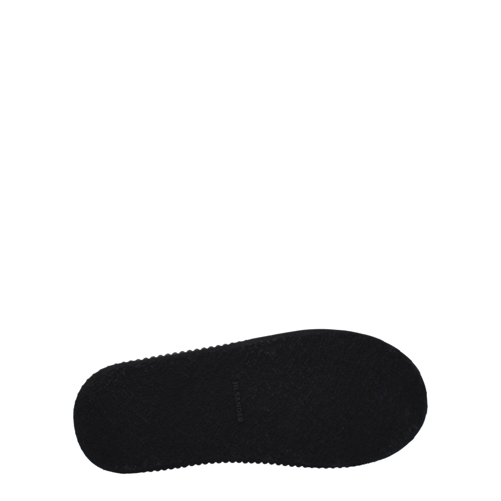 A single black fabric platform sneaker with a white logo on the side