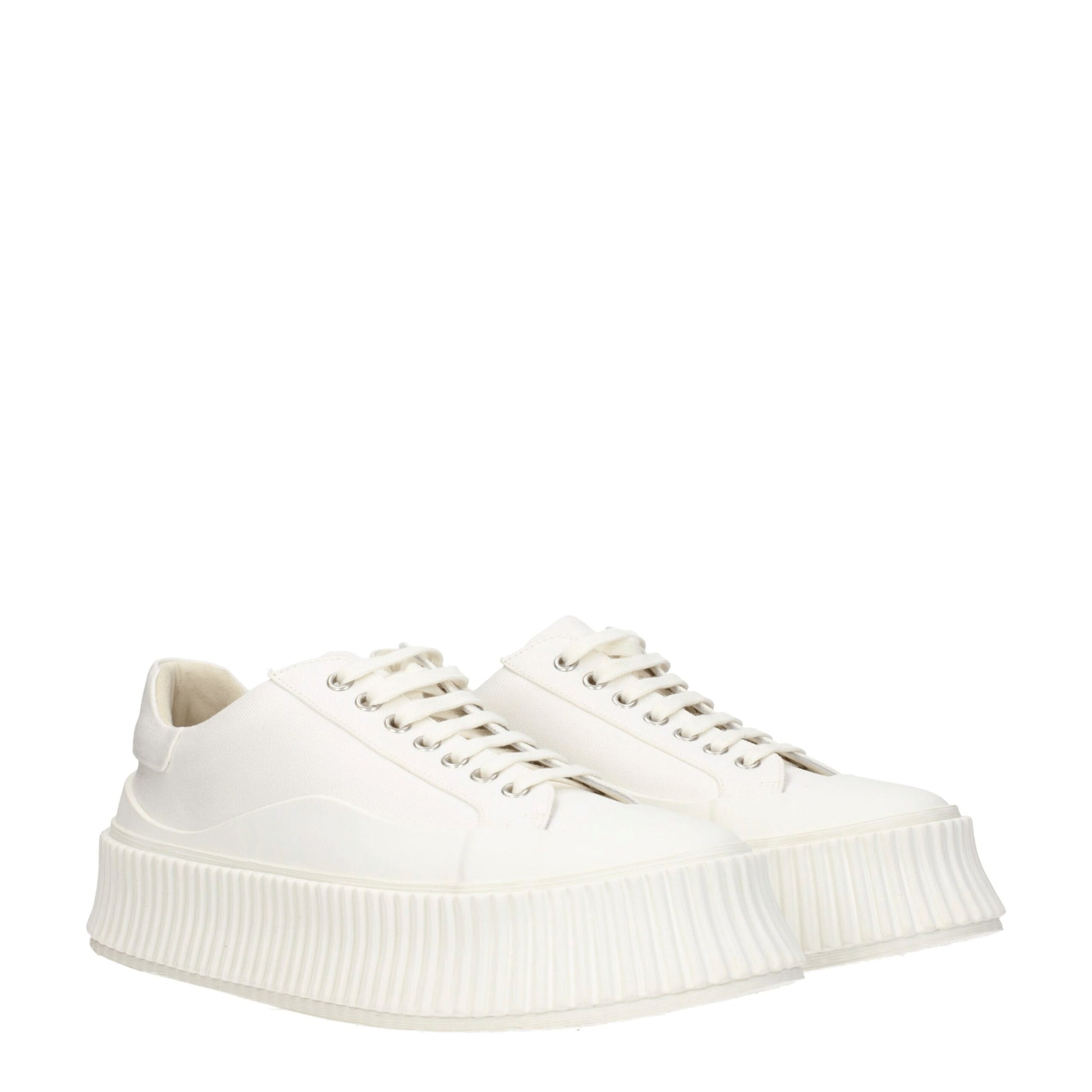 Pair of white platform sneakers with laces, designed by Jil Sander