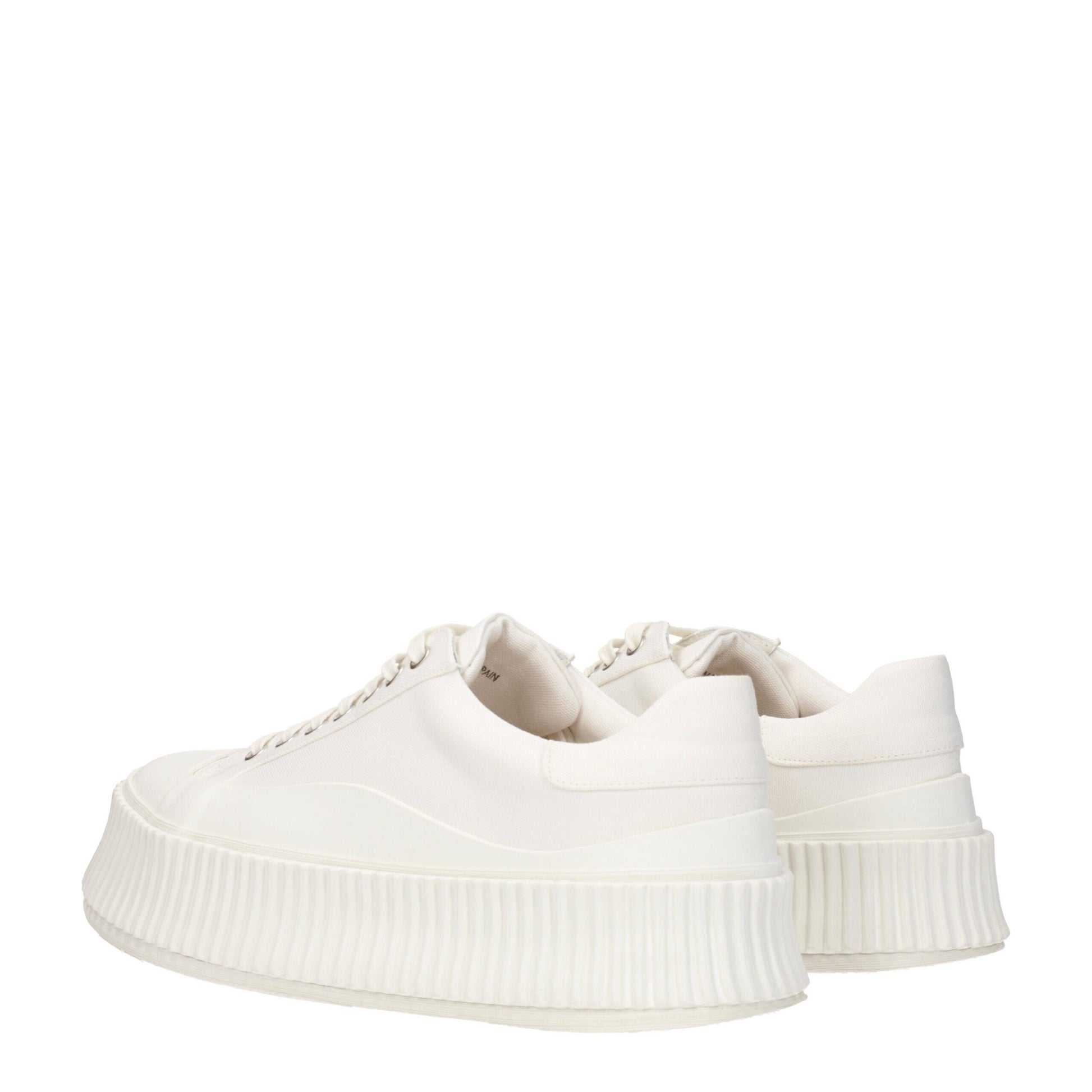 Pair of white platform sneakers with a textured sole