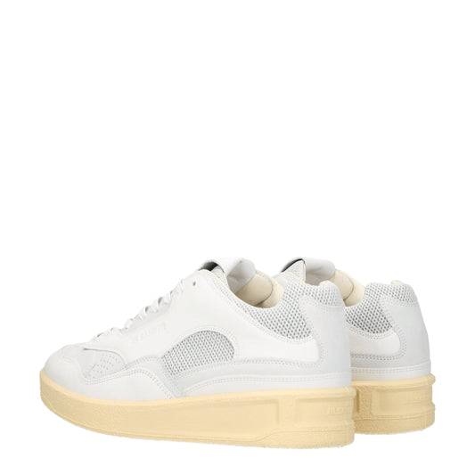 Pair of white leather low top sneakers with tan soles