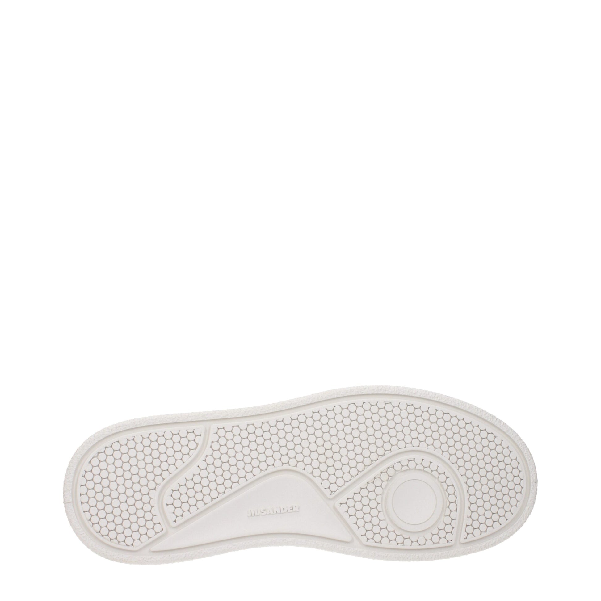 A single white leather platform sneaker with a textured sole, featuring a round toe and a small circular logo on the heel