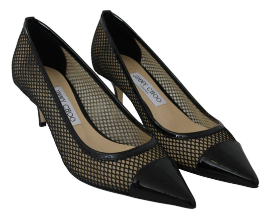 Pair of black and gold high heel shoes with pointed toe and stiletto heels