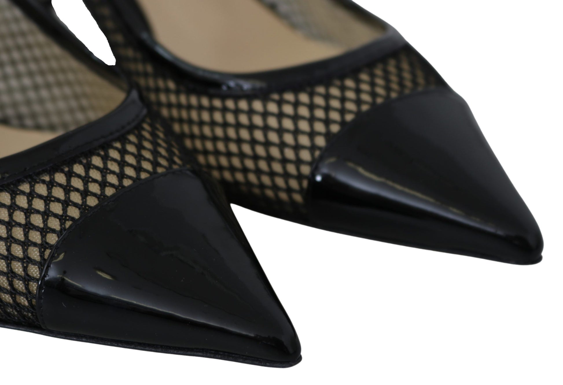 Pair of black high heel shoes with fishnet pattern on toe and heel