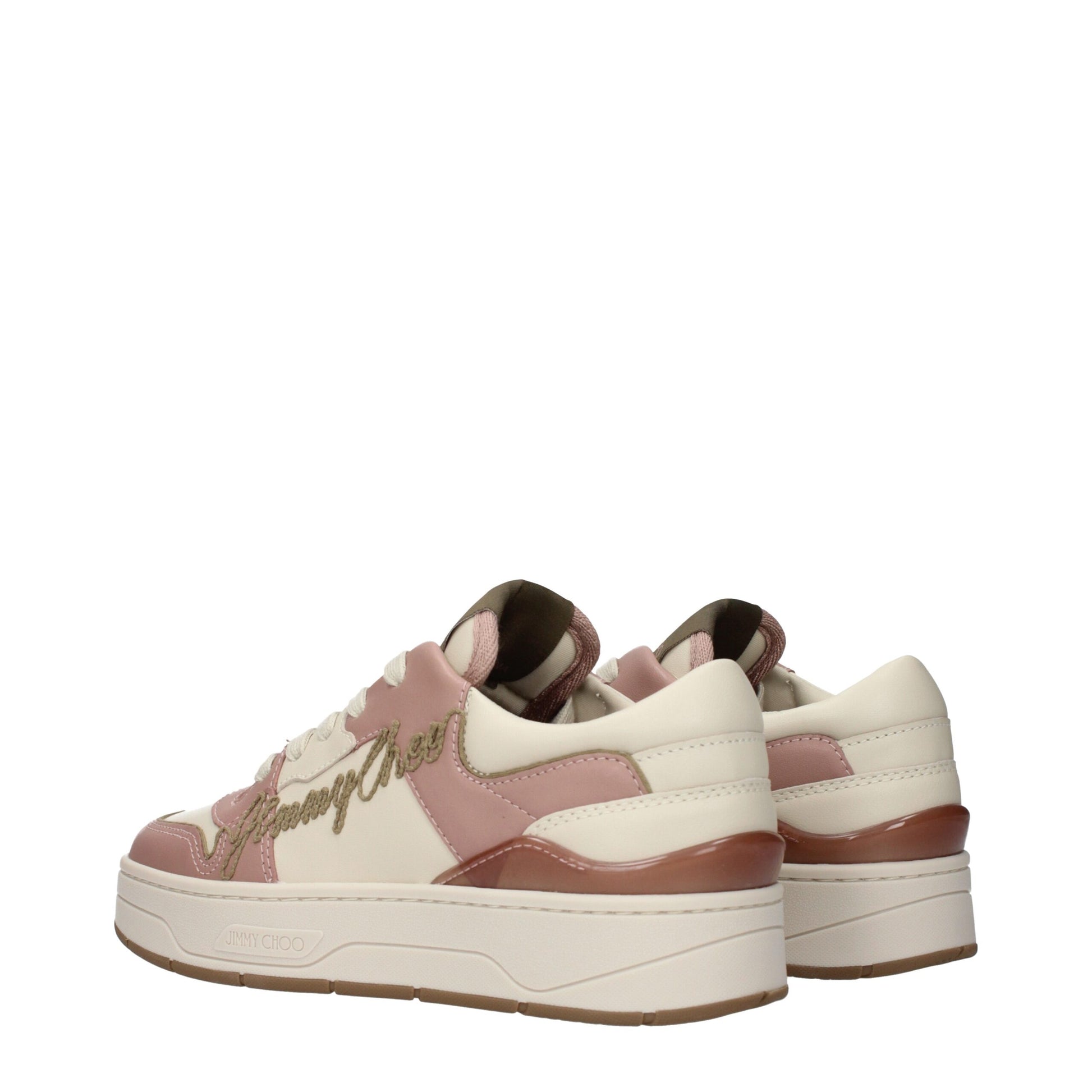 A pair of pink leather sneakers with gold lettering on the side, designed by Jimmy Choo