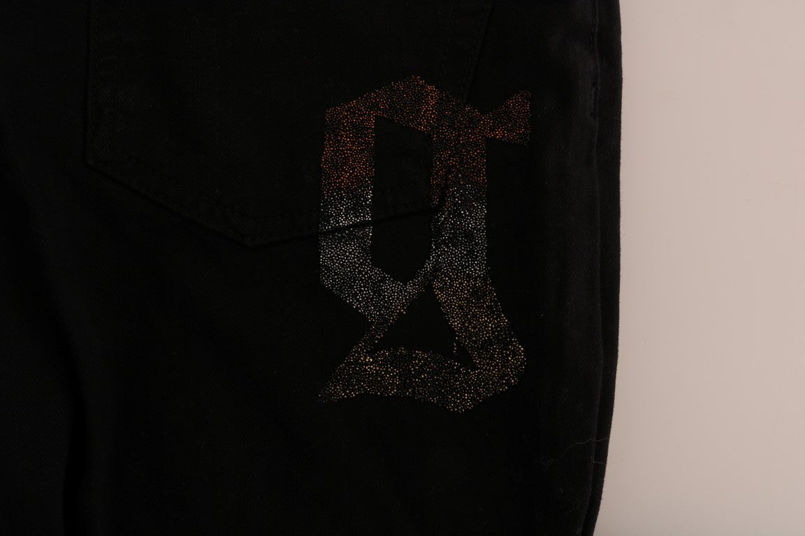 Black jeans with a glittery gold letter "G" on the back