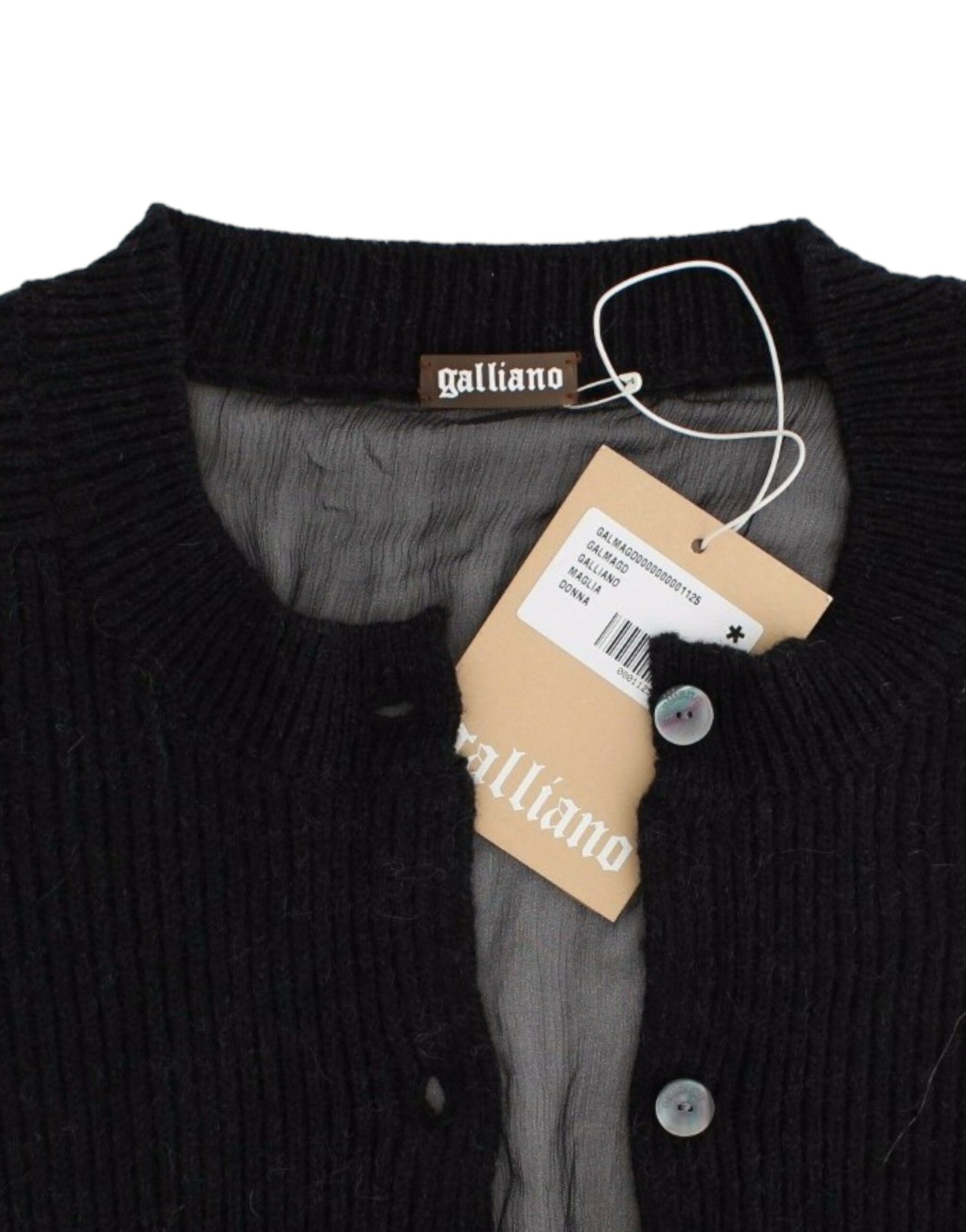 Black sweater with tag attached to neck