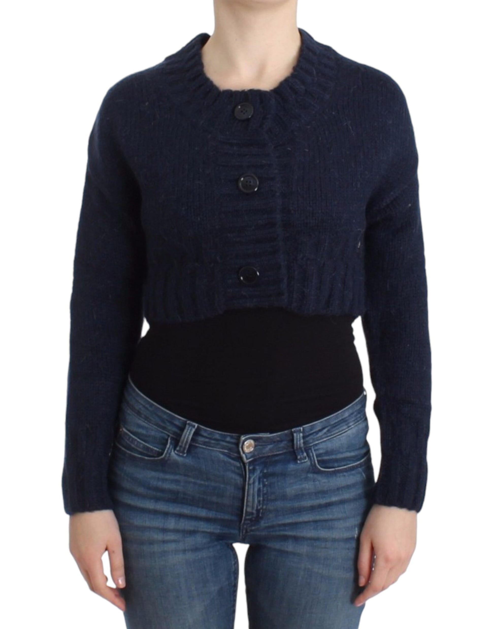 Woman wearing blue sweater over black top