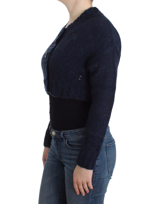 Woman wearing a blue sweater over black top and jeans