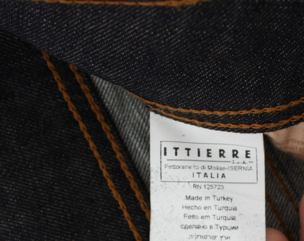 Denim jeans with tag showing brand, country of origin, and manufacturing details
