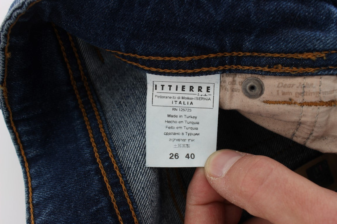 Hand holding blue jeans tag