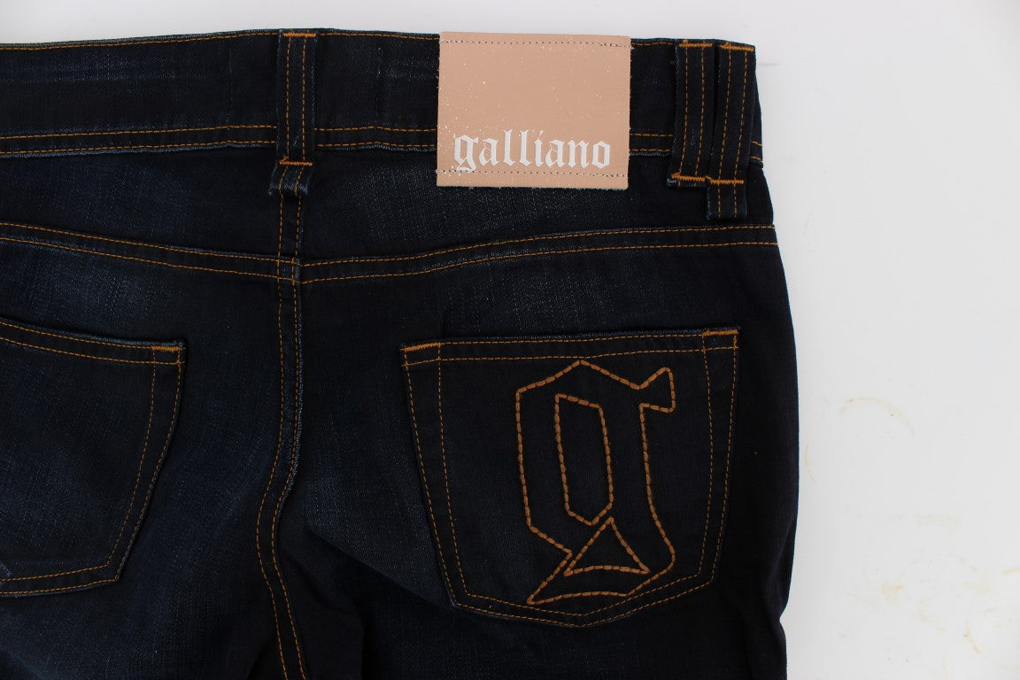 Pair of blue jeans with orange stitching and a tag on the waistband